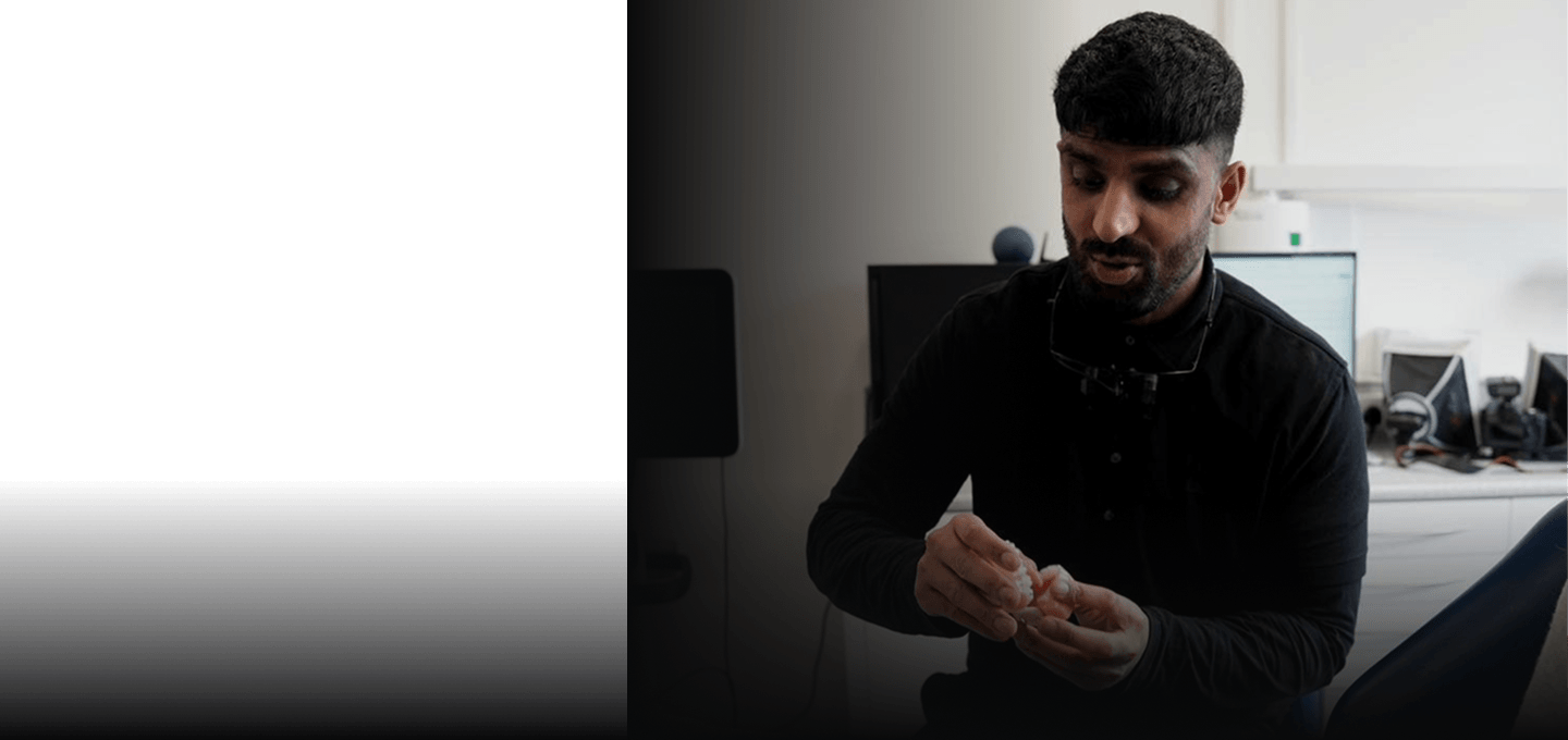 Dr Naeem explaining a treatment plan with a model of teeth