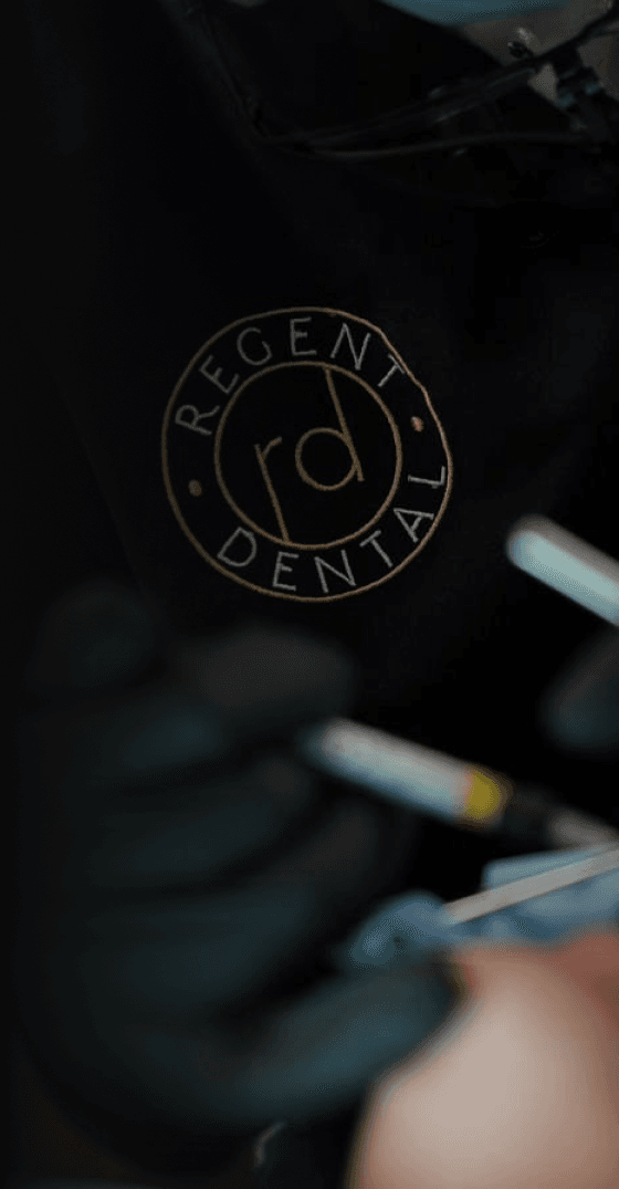 Close-up of a dental professional during a dental procedure.