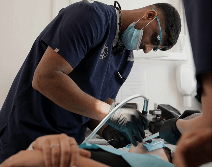 Dr Naeem Ashfaq at work treating a patient at Regent Dental