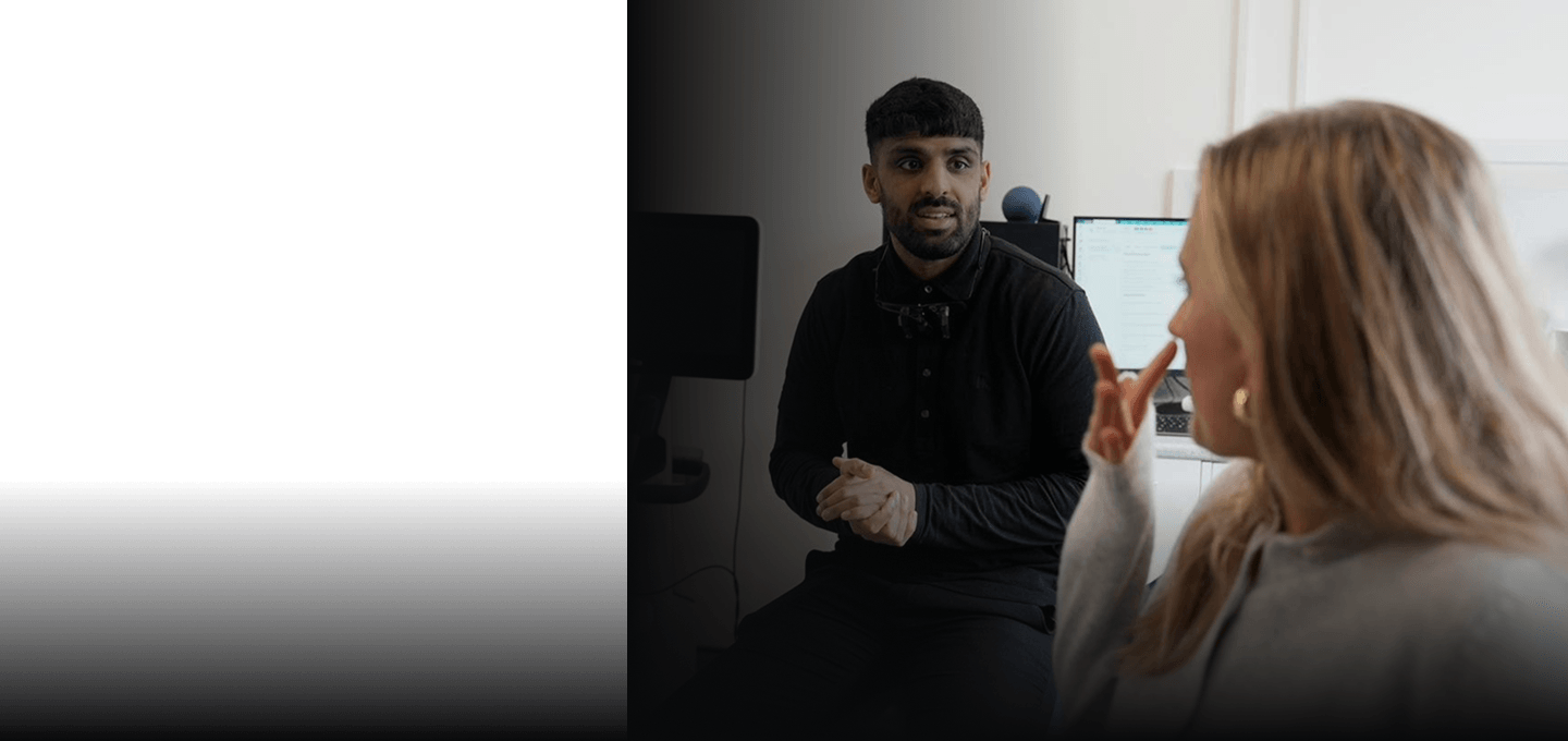 Dr Naeem Ashfaq talking with a patient during a consultation