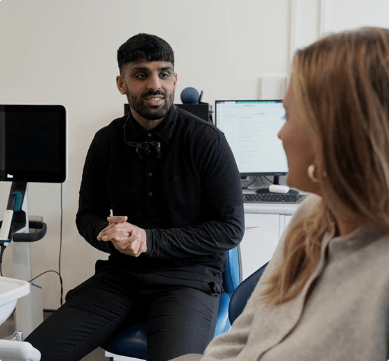 Dr Naeem Ashfaq consulting with a patient at Regent Dental